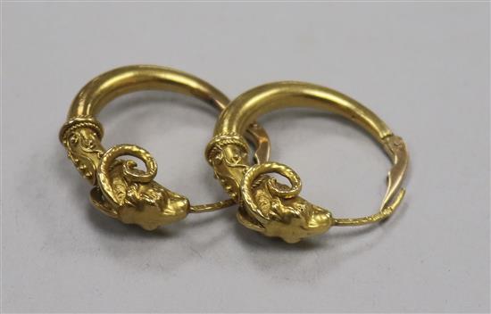 A pair of Polish 14ct gold rams head hoop earrings.